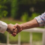 Tips for Navigating Job Interviews with Confidence Photo Confident handshake